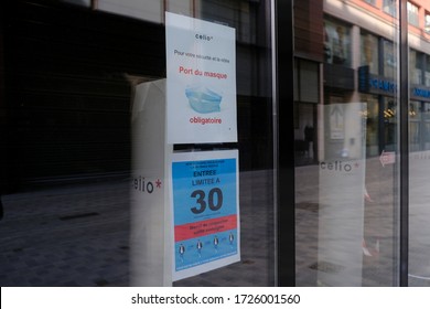 A Poster Advising Customers To Practise Social Distancing While Shopping At Entrance Of  Retail Shop During Covid-19 Outbreak In Brussels, Belgium, On May 8, 2020