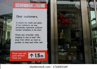 A Poster Advising Customers To Practise Social Distancing While Shopping At Entrance Of  Retail Shop During Covid-19 Outbreak In Brussels, Belgium, On May 8, 2020