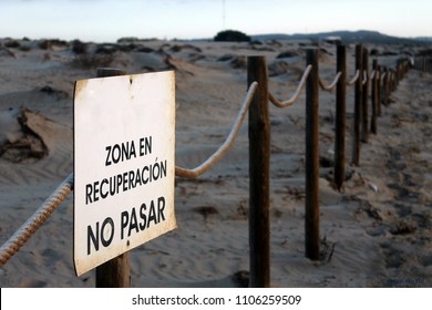 A poster announcing environmentally protected dune zone