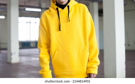 poster close up details of oversized yellow hoodie  at male.fashion and wear concept. trendн warm oversize wear at man.space for text and logo.close up details of oversize wear.horizontal banner wear - Shutterstock ID 2144814901