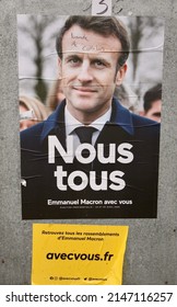 A poster of Emmanuel Macron in the village of Canisy, Normandy, France, ahead of Presidential Elections. The poster has been defaced with the words "Gang of Collaborators" Monday, 18th, April, 2022   