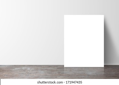 Poster Standing Next To A White Wall