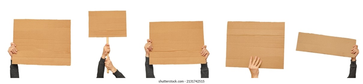 Posters of cardboard in his hands. Isolated on white. Set. Copy space. - Shutterstock ID 2131742515