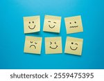 Post-it or Sticky notes with different sad and happy emotions