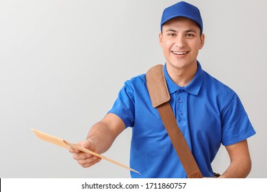 Postman with letters on light background