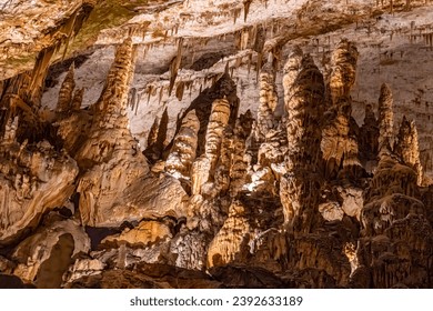 Postojna underground  caves with stalactites, stalagmites, colums and curtains.