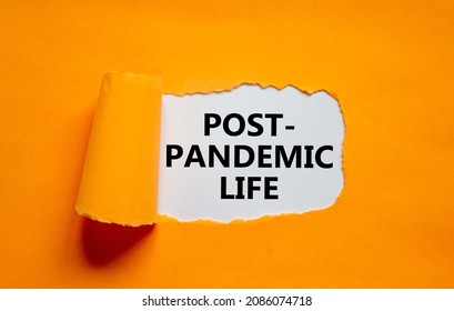Post-pandemic life symbol. Words Post-pandemic life appearing behind torn orange paper. Beautiful orange background, copy space. Medical and COVID-19 pandemic post-pandemic life concept. - Shutterstock ID 2086074718