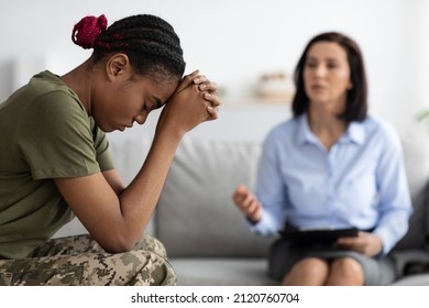 Posttraumatic Stress Disorder. Depressed Black Soldier Woman Attending Therapy Session With Psychotherapist, African American Military Lady Suffering Psychological Trauma After Army, Selective Focus