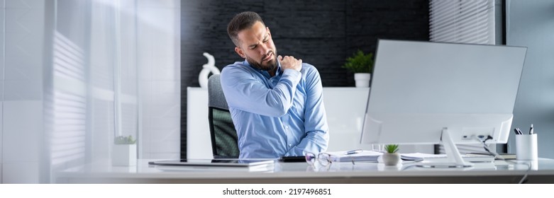 Posture Fatigue Shoulder Pain. Mature Man At Computer Workstation