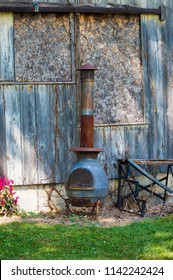 A Pot Belly Out Side Wood Stove