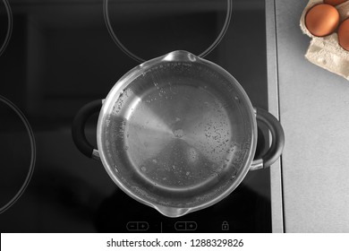 Pot With Boiling Water On Electric Stove In Kitchen, Top View