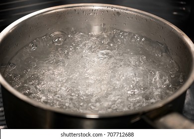 A Pot of Boiling Water with Steam