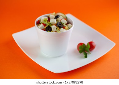 A Pot Of Delicious Greek Salat Isolated On A White  Plate