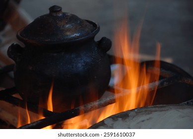 A pot in the fire. A rustic Kitchen.