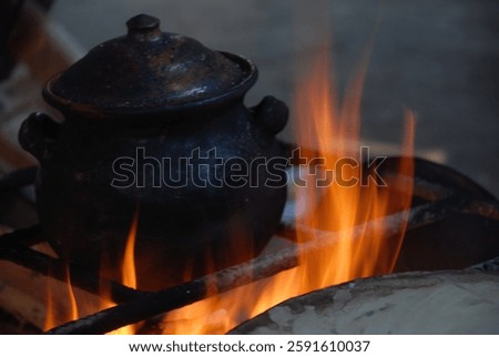 A pot in the fire. A rustic Kitchen.