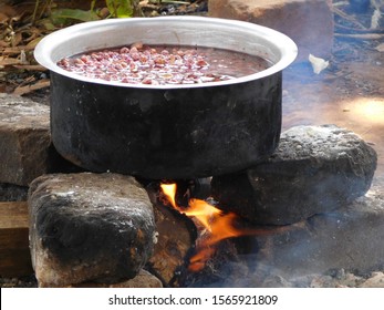 Pot Of Food Cooking Over Open Fire, Uganda, Africa