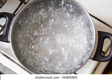 Pot full of boiling water on the stove