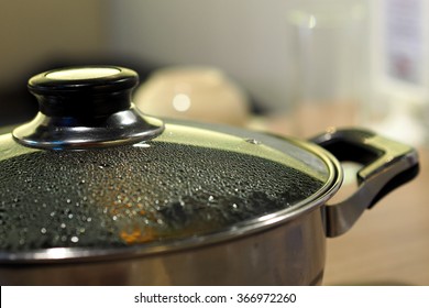 Pot With Glass Lid Closeup To See Water Steam Drops