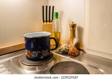 Pot on a Stove in an Old Kitchen