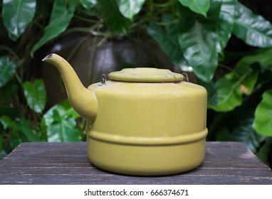 Pot on table,Old yellow pot,rust,side view
