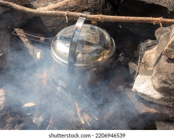 Pot Over A Fire In A Stone Hearth