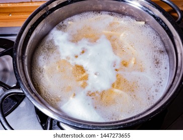 Pot With Pasta Boiling Over The Fire