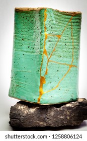 A Pot Repaired With The Japanese Art Form Of Kintsugi Using Urushi Lacquer And Gold Powder.