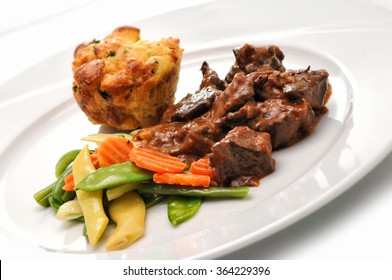 Pot Roast Beef With Roasted Vegetables And Dumpling On White Plate Isolated On White Background, Product Photography For Restaurant, DOF