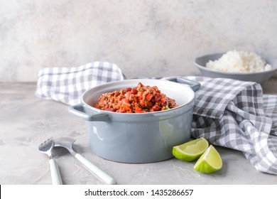 Pot With Tasty Chili Con Carne On Grey Table