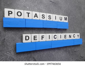 Potassium Deficiency, Word Cube With Background.