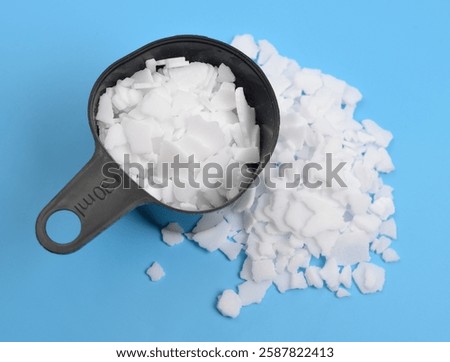 Potassium hydroxide KOH, and is commonly called caustic potash.