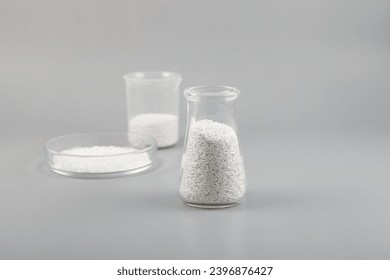 Potassium sorbate, oblong pellets in lab dishes. Granular potassium salt of sorbic acid. Food additive E202 used as food preservative, prevent mold and microbes and to increase shelf life. - Powered by Shutterstock