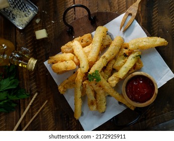 Potato Cheese Stick Or Long Potato Cheese On Rustic Bowl. Now It’s Popular Snack In Indonesia. Fried Crispy Nutritious Cheese Or Potato Sticks. Snacks For Beer And Hamburger. Oily.
