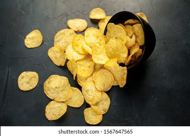 potato chips in a bowl, beer snacks on a stone background