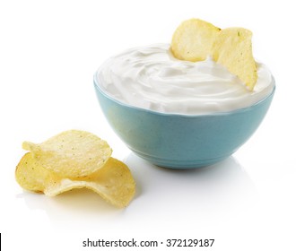 Potato Chips And Bowl Of Dip On White Background