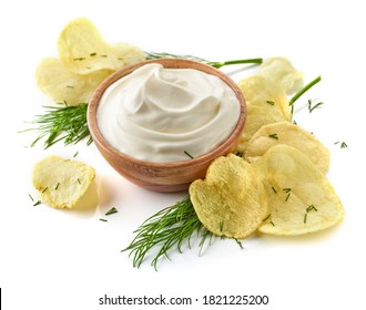 Potato Chips And Bowl Of Sour Cream Dip Isolated On White Background