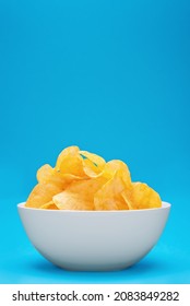 Potato chips or crisps in white bowl on blue background - Shutterstock ID 2083849282