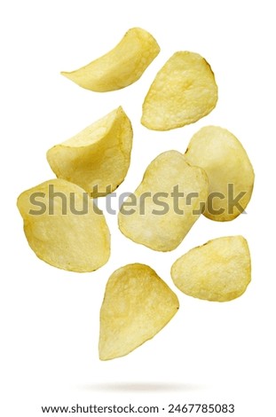 Potato chips falling close-up on a white background. Isolated