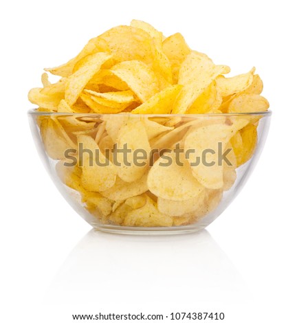 Potato chips in glass bowl isolated on white background
