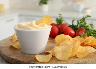 Potato Chips And Mayonnaise On Wooden Board