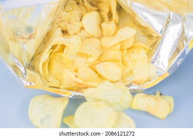 Potato Chips Spilled Out Of The Bag.