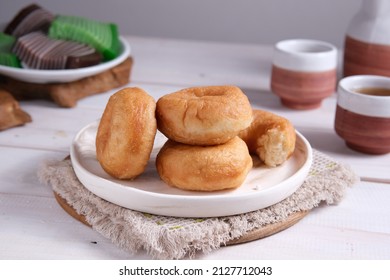 Potato Donuts on a white plate.  Donuts made from donut dough plus steamed potatoes.  Usually served with or without sprinkled with powdered sugar