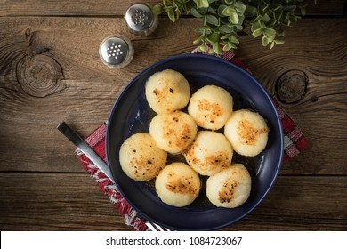 Potato dumplings with meat on a plate.