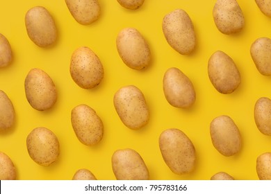 Potato on a colored background. Pattern of potato. Natural potato