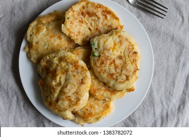 Potato Pan Cakes On White Plate - Top View Of Cheesy Hash Browns