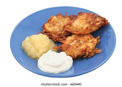 Potato Pancakes (latkes) For Hanukah, Served With Sour Cream And Applesauce. Isolated.