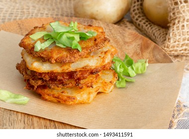 Potato Pancakes Stack, Draniki, Deruny, Potato Latkes, Latkas, Irish Cakes, Raggmunk Or Boxties On Wood Plate. Fried Grated Vegetable Pancakes Or Potato Fritter With Onion On Rustic Background