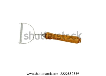 Potato peeler, a kitchen tool used to peel vegetables with tough skins capable of being sliced.Isolated on white background