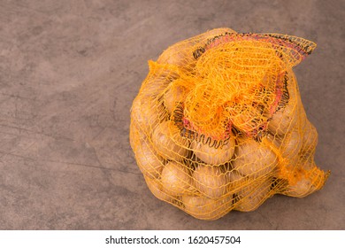 Potato Sack On A Textured Background, Empty Copy Space