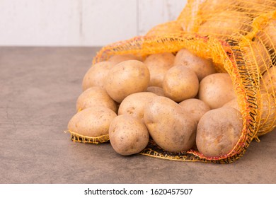 Potato Sack On A Textured Background, Empty Copy Space